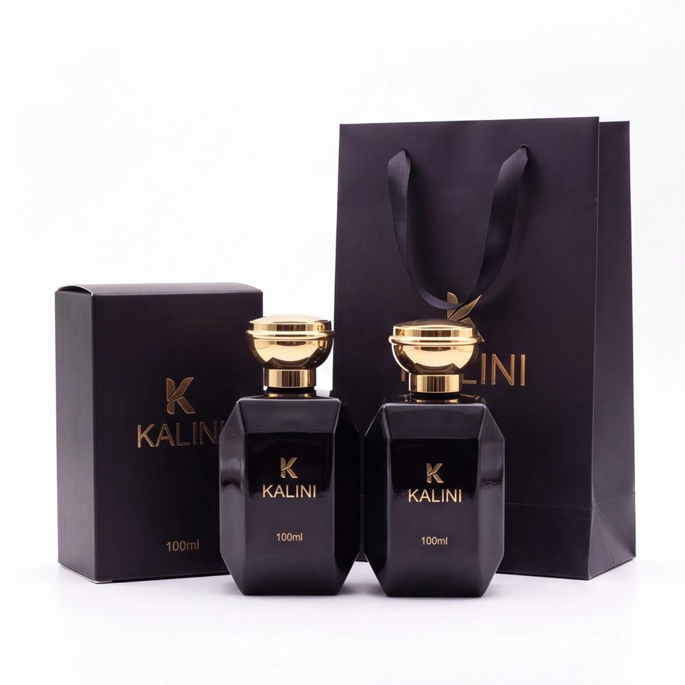 Two 100ml perfume bottles with a branded folding carton and paper carry bag